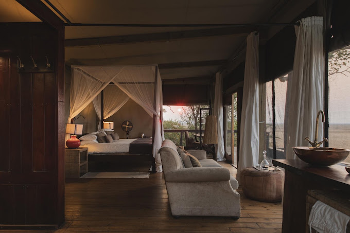 Zelt-Suite im Wilderness Shumba mit Blick ins Grün der Busanga Plains im Kafue-Nationalpark in Sambia